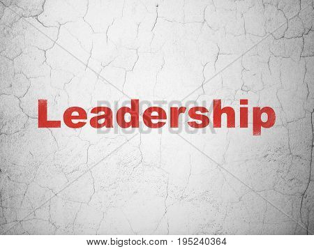 Finance concept: Red Leadership on textured concrete wall background