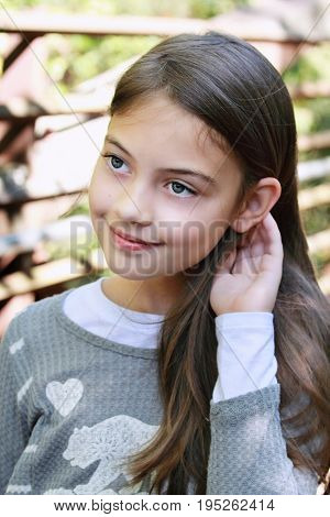 Young beautiful pre-teen girl with long hair.