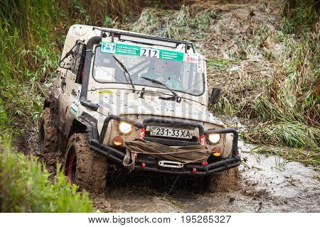 KIRILLOVKA UKRAINE - MAY 25 2016: Zaporizhia Trophy 2016. II stage of offroad trophy Ukrainian championship. Legendary car UAZ in swamp.