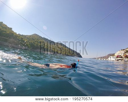 Brunette woman snorkelling