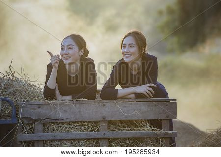 country girl portrait in outdoorsHappy rural girl smiling in fieldportrait of a happy young asian woman.