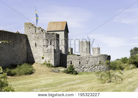 Town Wall in Visby Gotland with the Swedish flags.