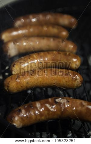 Sausage in a rown on Barbecue Close Up.