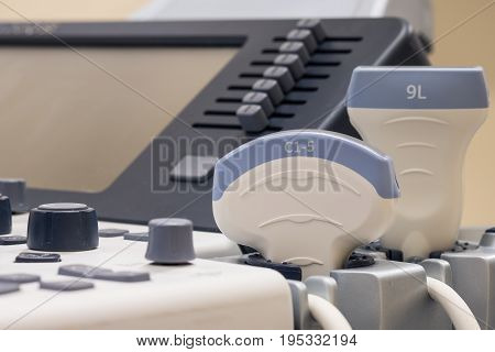 Close up view of an ultrasound machine with two transducers