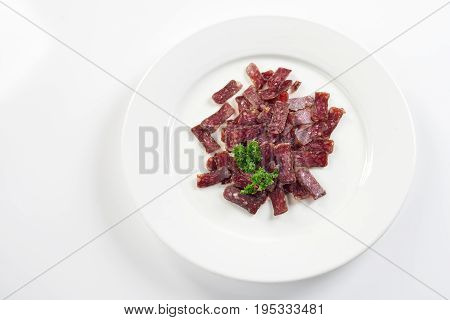 Jerky. Sujuk. Snack to beer. On white background menu concept.