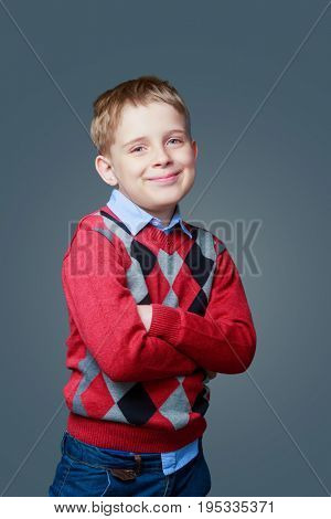 happy boy isolated against grey background
