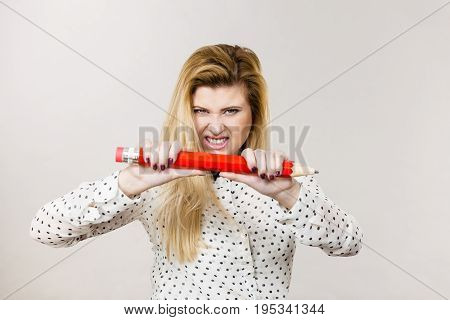 Angry Woman Holds Big Pencil In Hand