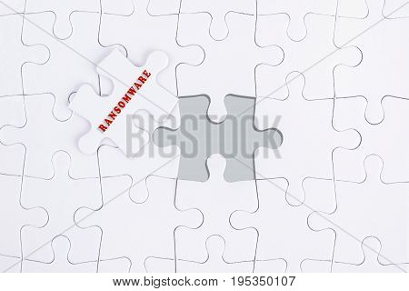 Missing White Puzzle With Ransomware Word And Copyspace Area.