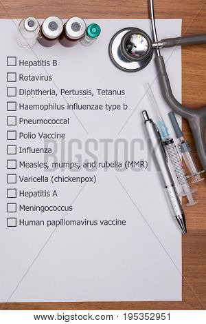 Doctor are checking his patient's Vaccination schedule.