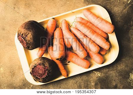 Freshly picked organic carrots and beets from a nearby market.