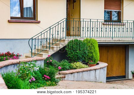 Village House Entrance Decorated By Flowers