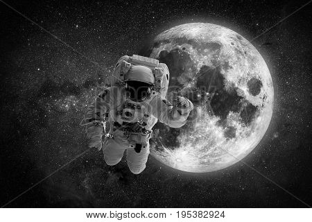Astronaut spaceman outer space people planet earth moon. Beautiful blue sunrise. Elements of this image furnished by NASA.