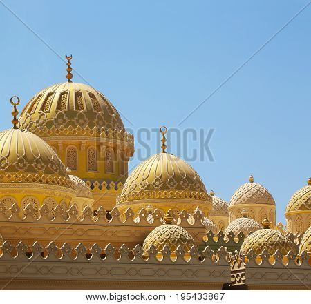 Mosque in Hurgada, Egypt behind blue sky