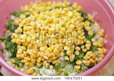 Fresh salad with canned corn cabbage and parsle