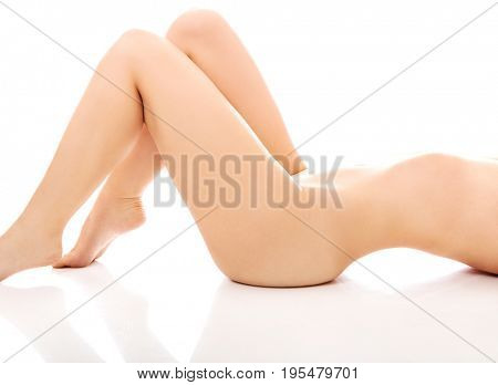 Nude woman lying on the floor