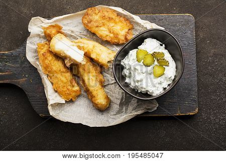 Fish dish - Cod in beer batter with tar tar sauce for a healthy and comfortable diet.