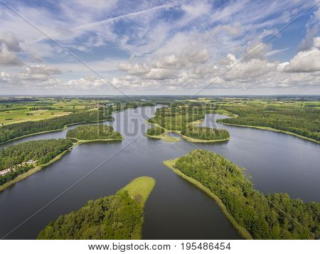Aerial View Of Green Islands And Clouds At Summer Sunny Day.wydminy Lake On Masuria In Poland.
