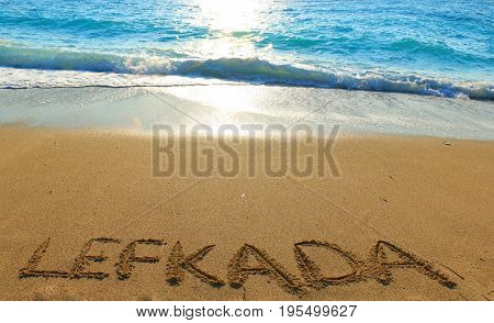 Lefkada written on sandy beach in Greece
