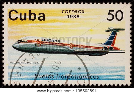 Moscow Russia - July 14 2017: A stamp printed in Cuba shows passenger airliner Ilyushin IL-62 Airline Havana-Moscow (1987) series 