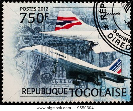 Moscow Russia - July 14 2017: A stamp printed in Togo shows Henri Perrier and supersonic airliner Concorde series 
