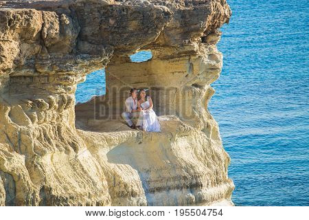 Romantic dating. Young loving couple walking together by the beach enjoying sea.