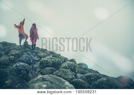 Lover Men and women Asia travel relax. walk in the forest rainy season. puhinrongkla Thailand