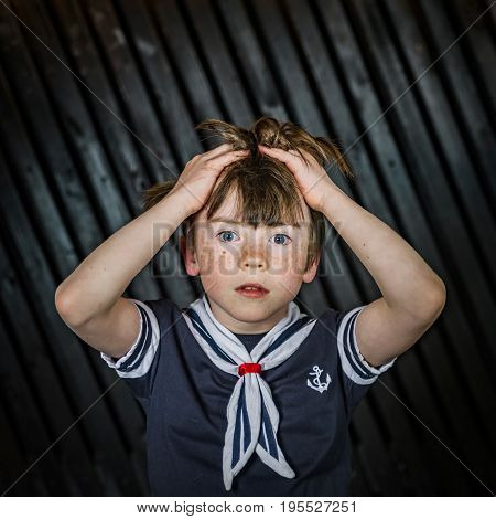 Schoolboy Posing In Sailor Costume With Emotions