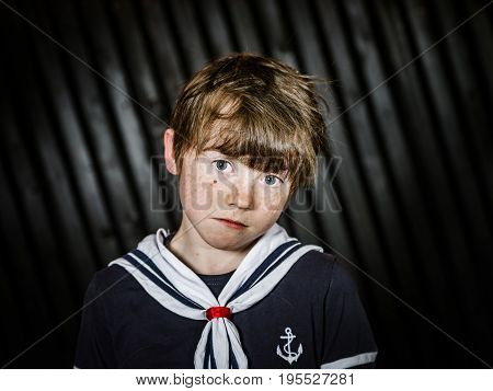Schoolboy Posing In Sailor Costume With Emotions