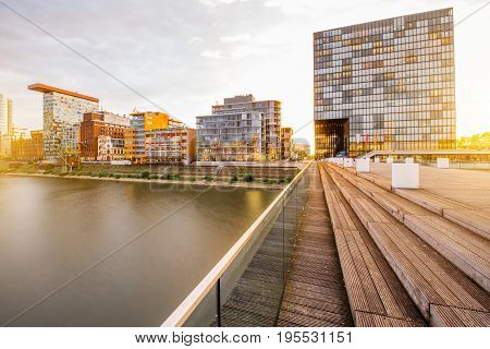 Sunset view on the Medienhafen financial district with modern buildings in Dusseldorf city, Germany