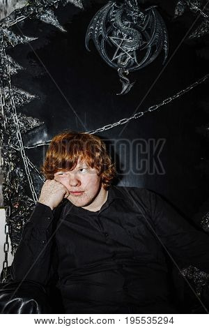 Red-haired Boy Sitting On The Magic Throne