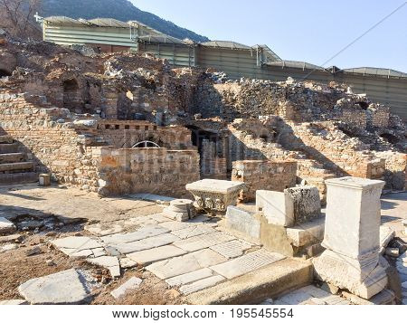 Roman Stone Pillars And Terraced Hosues Ruins On Road Side In Ephesus Archaeological Site In Turkey