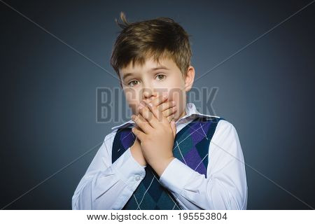 Closeup Scared and shocked little boys. Studio shot portrait over gray background. Human emotion face expression. Life perception achievement vision.