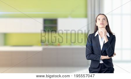 Young Beautiful Business Woman And Creative Designer Standing Over Blured Interior Background
