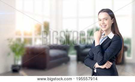Young Beautiful Business Woman And Creative Designer Standing Over Blured Interior Background