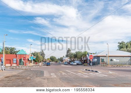 KEIMOES SOUTH AFRICA - JUNE 12 2017: A street scene with businesses and vehicles in Keimoes in the Northern Cape Province