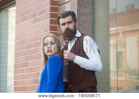 Girl And Man Standing With Bottle Of Wine
