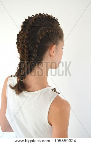 Hairstyle with long hair - young girl on a white background