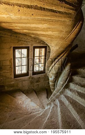 Lourmarin, France - July 07, 2016. View of stone staircase with dramatic light at Lourmarin castle, near the lovely village of Lourmarin. Vaucluse department, Provence region, southeastern France