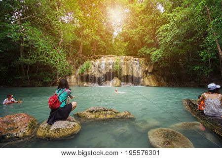 People Traveling And Bath In Erawan Waterfall, Thailand