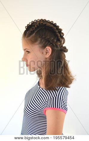 Hairstyle with long hair - young girl on a green background