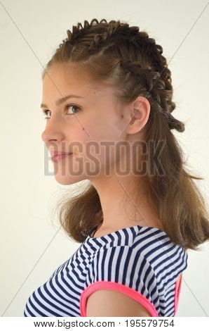 Hairstyle with long hair - young girl on a white background
