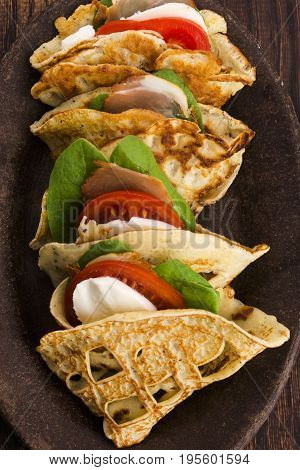 Pancakes Sutffed With Ham, Cheese, Tomatoes And Spinach