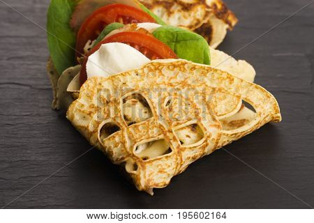 Pancakes Sutffed With Ham, Cheese, Tomatoes And Spinach