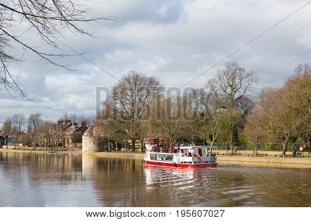 York England boat trip on the River Ouse a popular tourist attraction