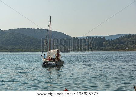 NYDRI, LEFKADA, GREECE -  JULY 17, 2014: Boats at Port of Nydri Bay, Lefkada, Ionian Islands, Greece