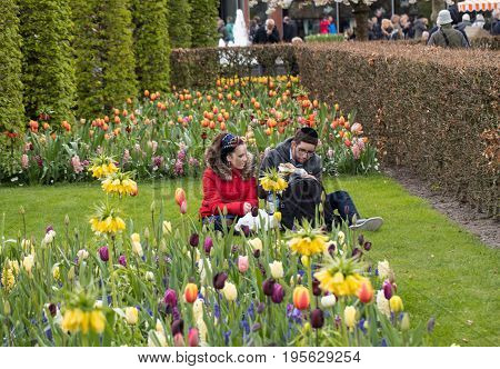 LISSE NETHERLANDS - APRIL 19 2017: Visitors at the Keukenhof Garden in Lisse Holland Netherlands.