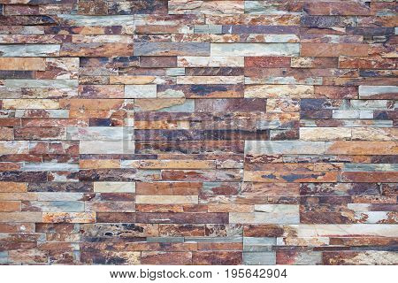 Close-up of stone wall pattern natural surface. Modern and creative interior and exterior walls design. Brick wall building and brick wall decoration texture.