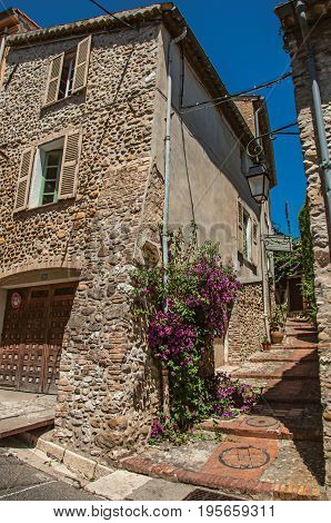 Haut-de-Cagnes, France - July 14, 2016. View of alley with house on the slope and flowers in Haut-de-Cagnes, a pleasant village on top of a hill. In Alpes-Maritimes department, Provence region