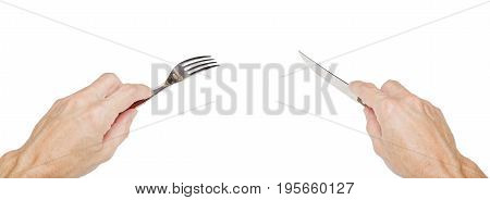 Humans Hands Holding A Silver Fork And Knife