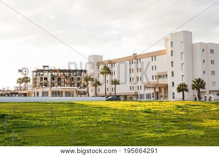 Protaras, Cyprus - February, 15, 2017. Construction's cars working on the construction of a new hotel in Protaras. Urban scene